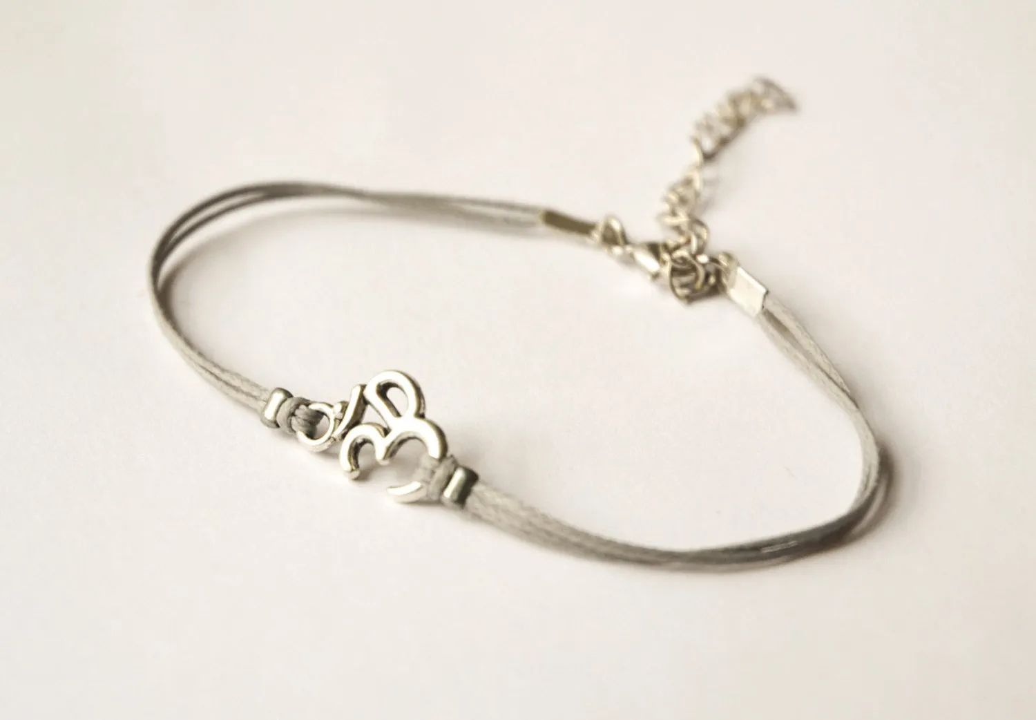 Dainty gray cord anklet with silver tone Om charm, yoga gift, adjustable ankle bracelet