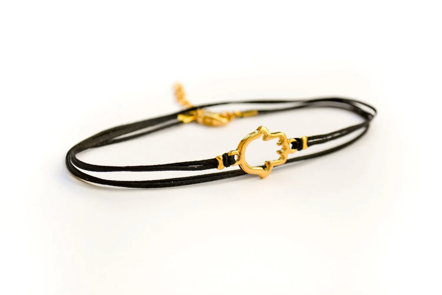 Dainty wrap cord anklet with a gold Hamsa charm