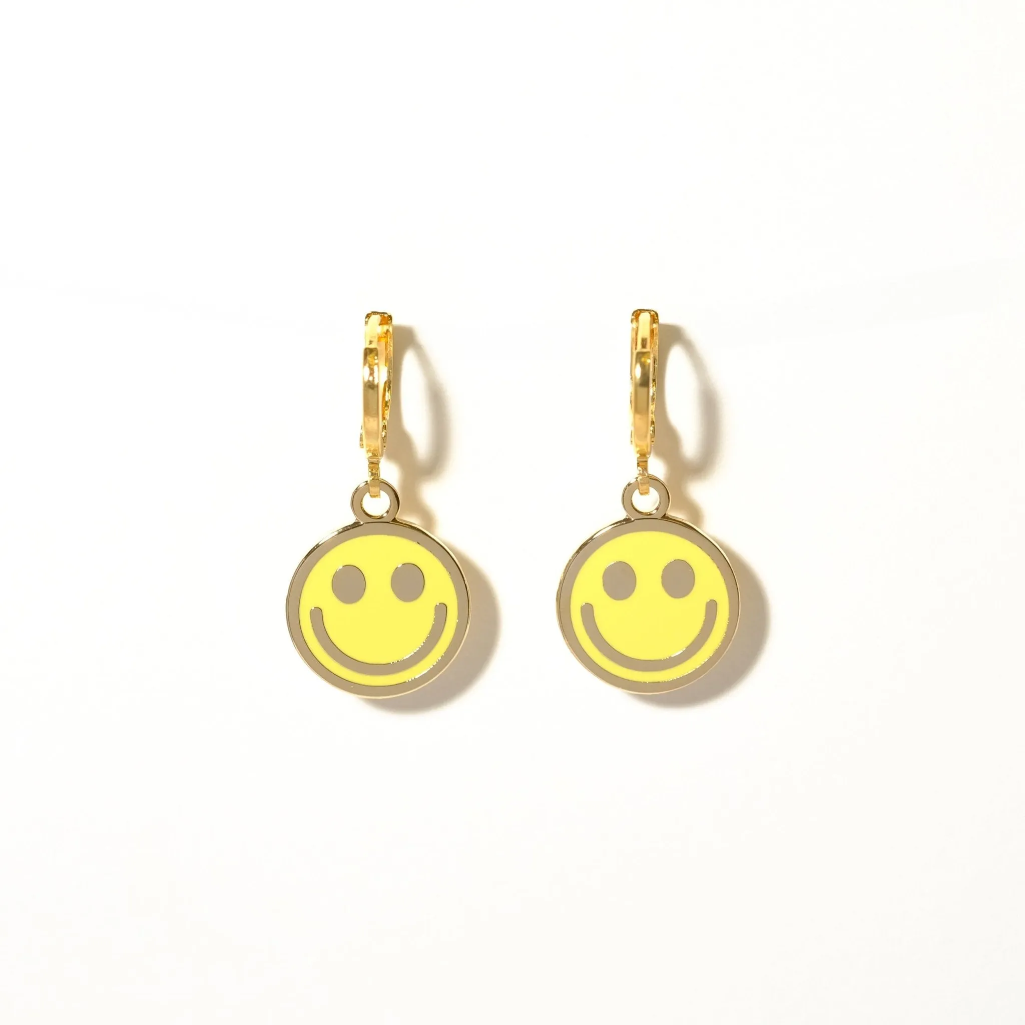 Smiley face huggie hoop earrings